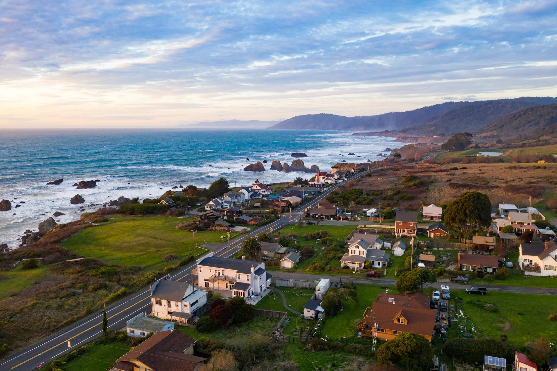 The Westport Headlands and the shoreline at dusk