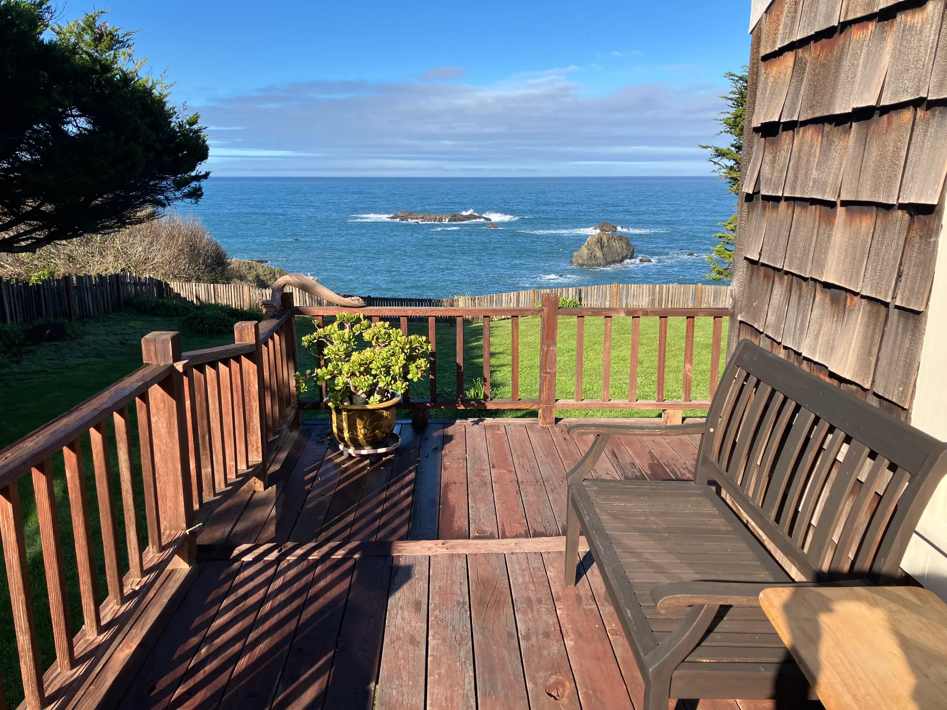 The wraparound redwood deck looking onto the headlands and rocks